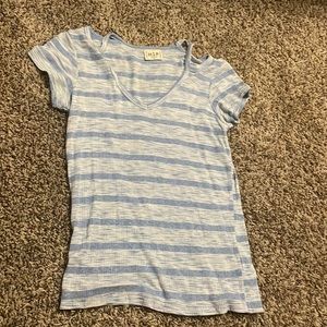 Light blue shirt bought from Buckle. Small slits on shoulders. Size XS